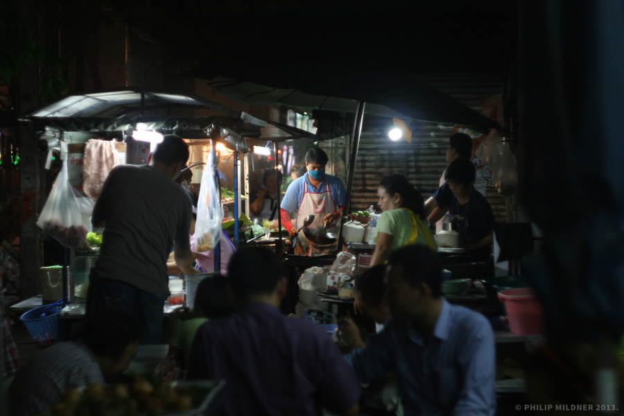 Busy street life in Bangkok, near Chinatown.