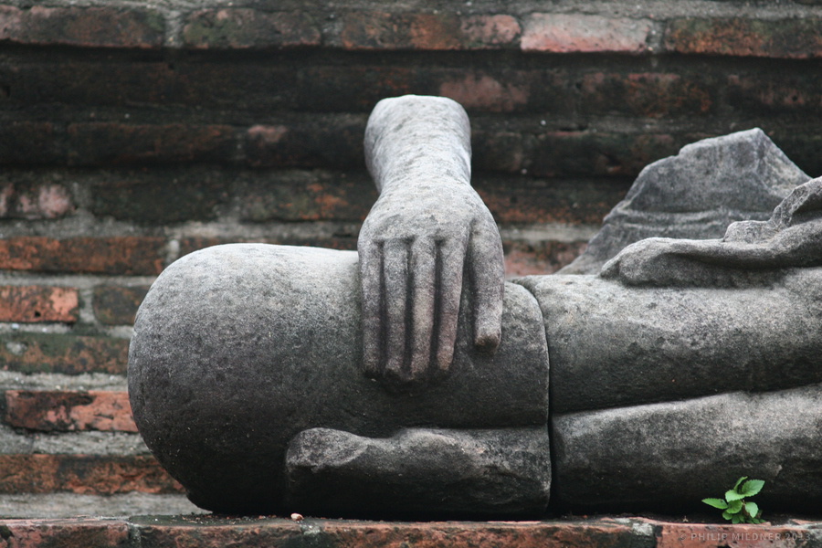 Destroyed Buddha figure in the historical park of Ayutthaya.